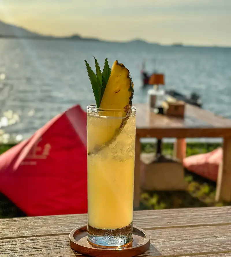 Pineapple cocktail with sea view